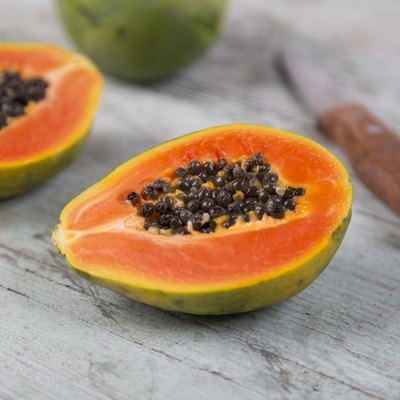 Sliced papaya on wood