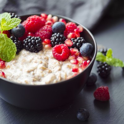 Healthy organic porridge topped with berries