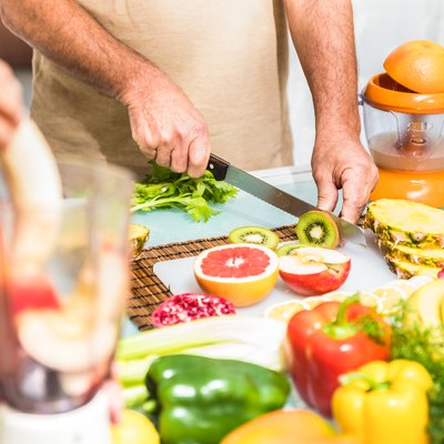 Detail of couple in kitchen with healthy food to clean out colon