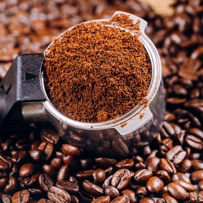 Coffee beans and portafilter for espresso coffee machine