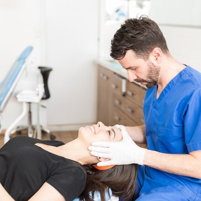 woman laying down in dermatologist office