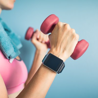 Woman holding dumbbells