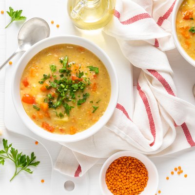 Vegetarian vegetable lentil soup with fresh parsley, healthy eating, top view