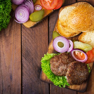 Directly Above Shot Of Burgers On Cutting Board
