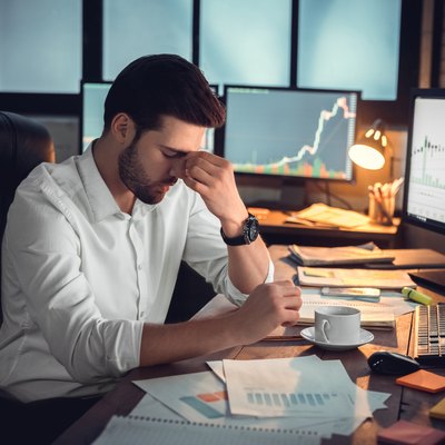 Depressed frustrated trader tired of overwork or stressed by bankruptcy