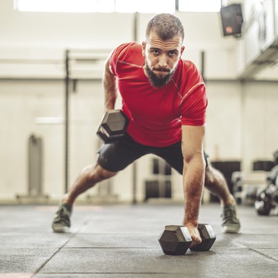 Man is doing cross-training exercise wearing men's workout shorts