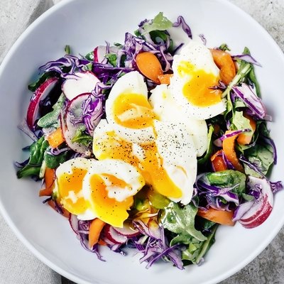 Fresh salad with soft boiled eggs