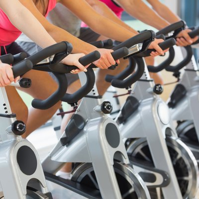 Mid section of people working out at exercising class