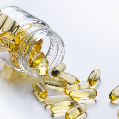 Fish oil spilling from bottle