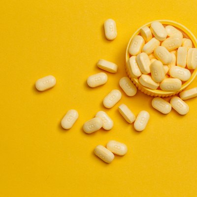 vitamin B12 tablets on yellow background