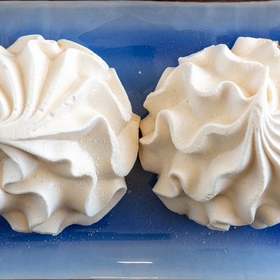 Two baked meringue kisses, sweet food