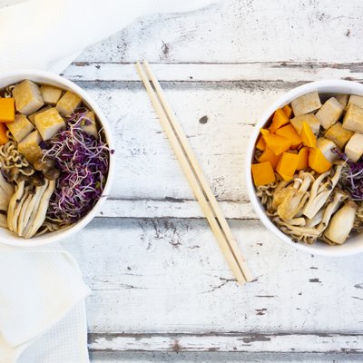 Miso Ramen soup with noodles, hokaido pumpkin, red radish sprouts, fried tofu, shimeji mushroom and king trumpet mushroom