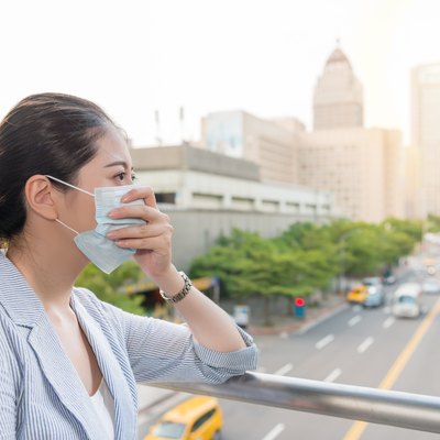 businesswoman feels allergy from bad air