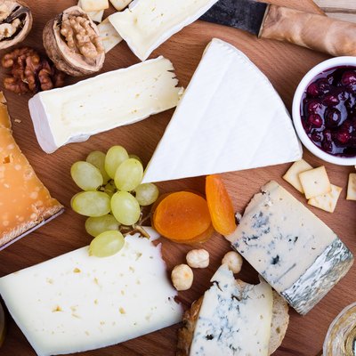 Cheese platter with fruits and wine