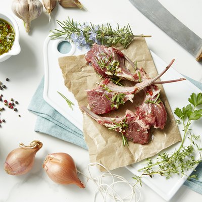 Raw fresh lamb chops with herbs and gremolata