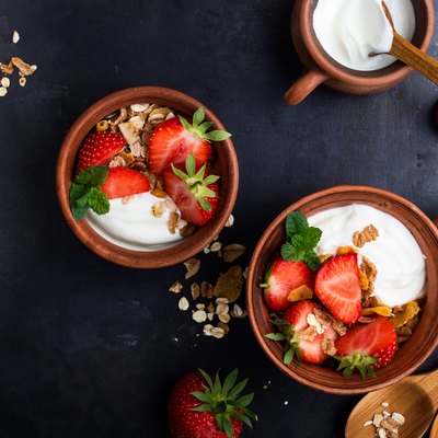 Breakfast with muesli, yogurt and fresh strawberries