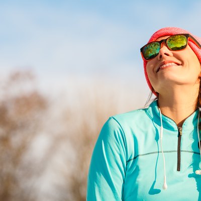 Female fitness sport model outdoor in cold winter weather