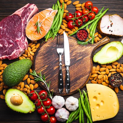 Top view of a selection of foods that are good sources of dietary fat