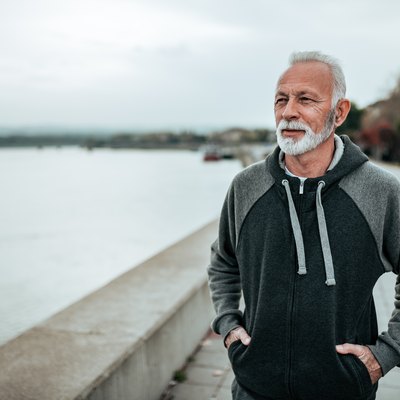 Man doing a beginner walking program by the beach