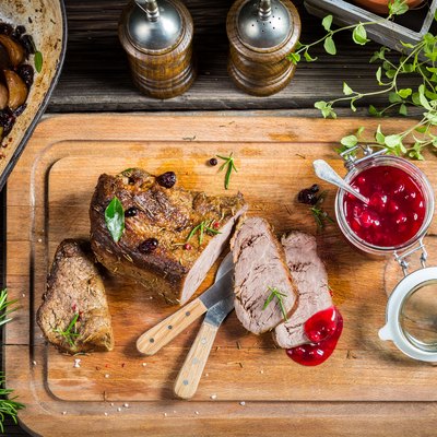 Freshly served venison with cranberries and rosemary