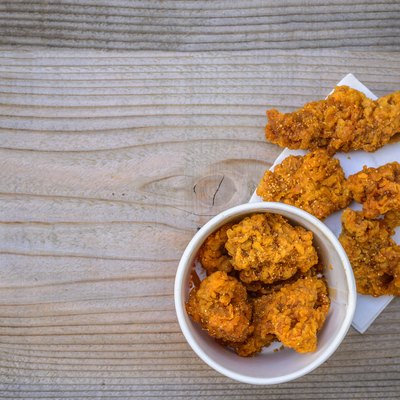 Fried chicken on a wooden floor.