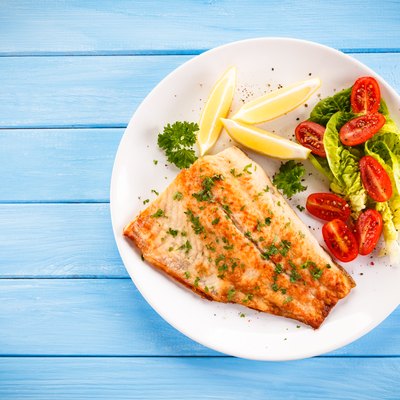 Fried cod fillets and vegetables