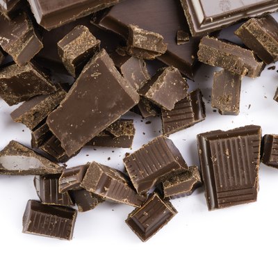 chopped chocolate pieces isolated on white