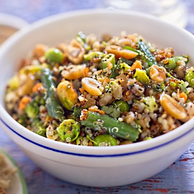 Quinoa, spelt, peanuts, almond, pistachios salad with soy and ginger dressing