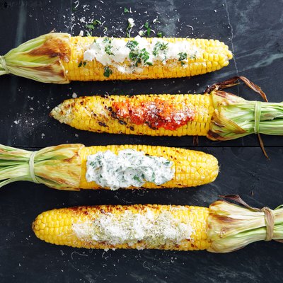 Grilled corn with toppings