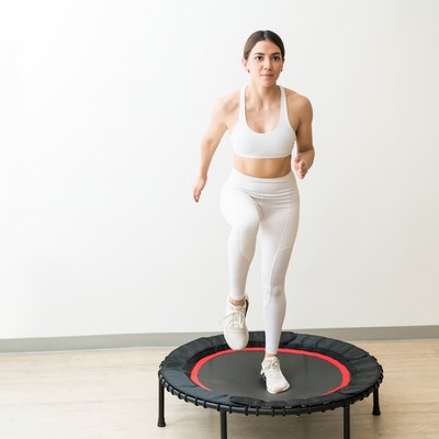 Attractive Slim Fit Female Exercising At Yoga Studio