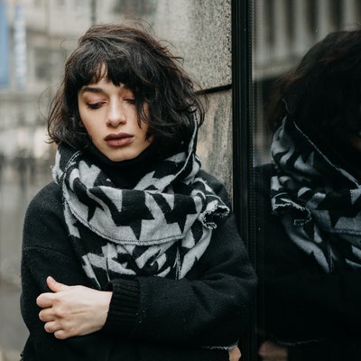 Portrait of a girl outdoors on a cold and gloomy day
