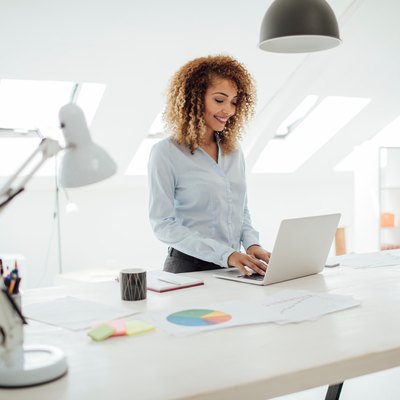 Latina Businesswoman Working In Her Office.