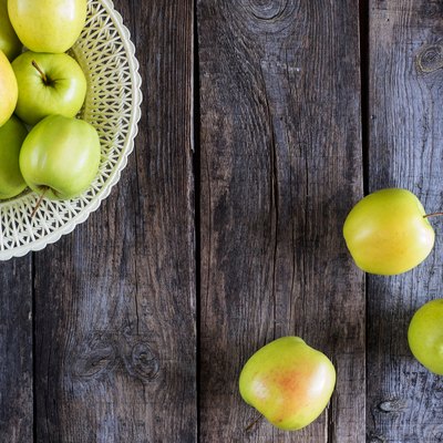 Directly Above Shot Of Granny Smith Apples On Wooden Table