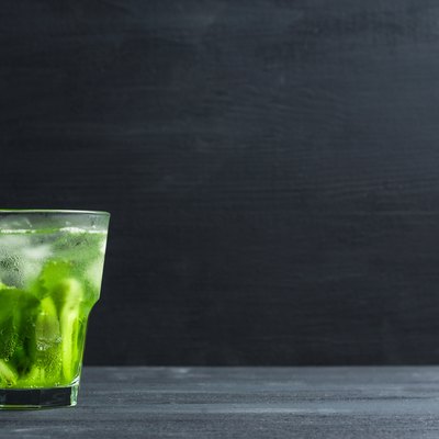 Green cocktail with kiwi slices