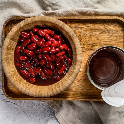 Red canned beans in an aluminum can. Gray background. Top view