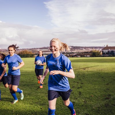 Healthy teenage girls with normal heart rates on sports field