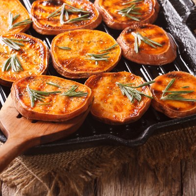 Grilled sweet potato rounds with rosemary on a grill pan