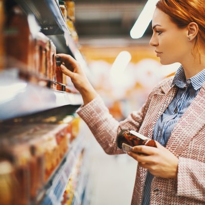 Woman looking at food in grocery store