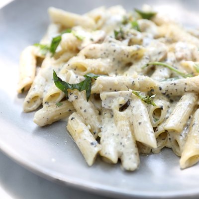 Penne pasta with white sauce and truffle , italian food
