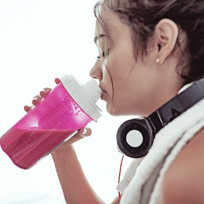 Woman drinking protein powder shake