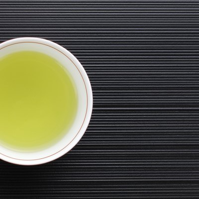 View from looking down into a cup of green tea in a cup