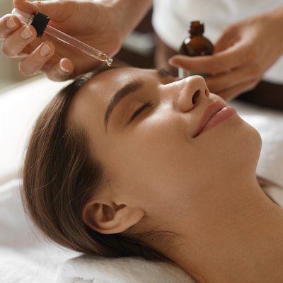 Face Skin Care. Woman Receiving Serum Treatment In Beauty Salon