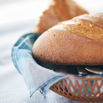 Close-Up Of Tasty Homemade Bread In Wooden Basket