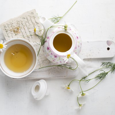 Chamomile tea in pot and cup