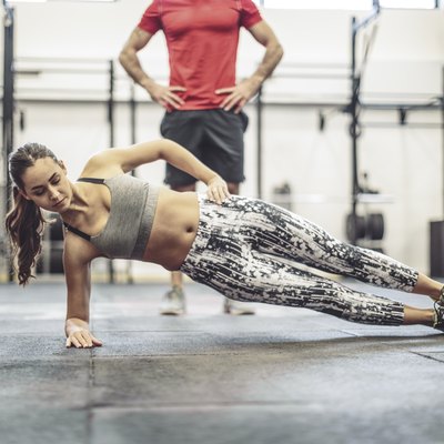 Young couple is doing cross training exercise together