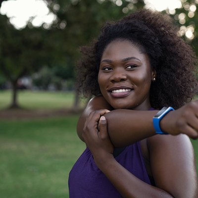 Smiling curvy woman stretching