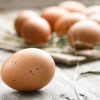 fresh organic farm eggs lie on burlap