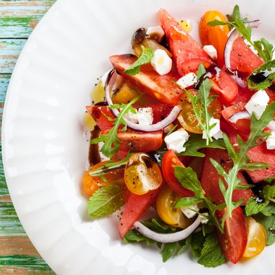Top view of a watermelon and tomato salad