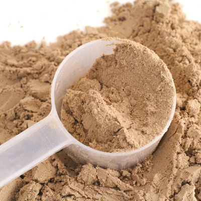 Soy Protein Isolate Powder in a scoop
