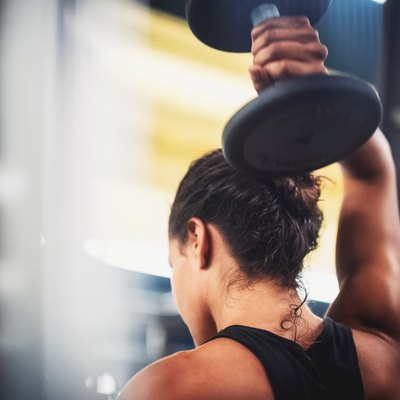 Close-Up Of Woman Lifting Weight